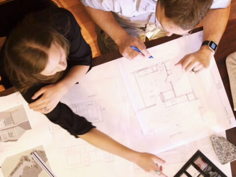 design-build contractor and designer discuss plans