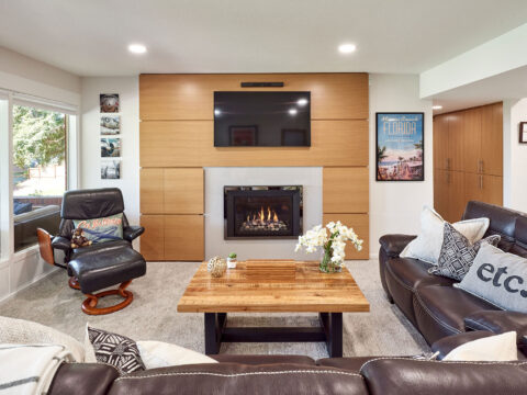 Basement remodel includes fireplace design. Custom home remodel from Henderer Design + Build + Remodel