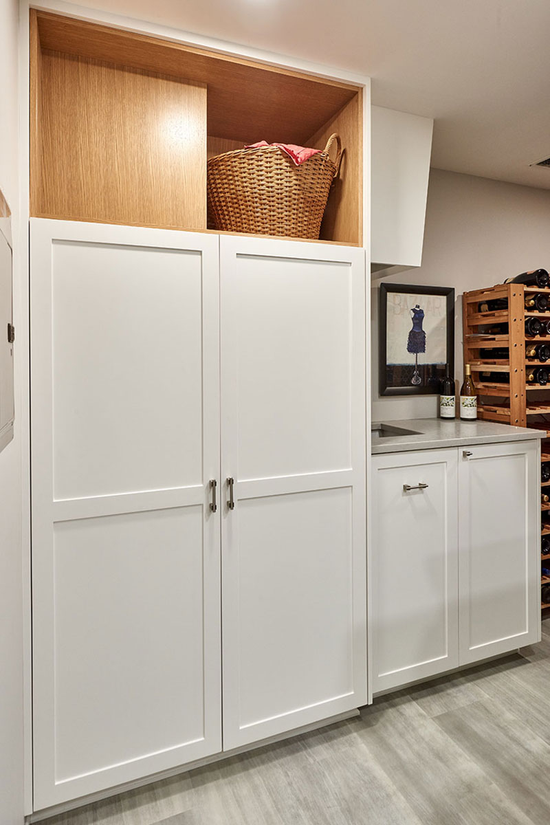 Basement remodel includes closet and cabinetry design. Custom home remodel from Henderer Design + Build + Remodel