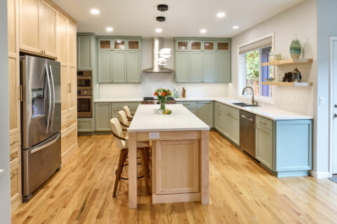 2022 Interior Design Trends kitchen showing green sage custom cabinetry and soft maple wood cabinetry and island