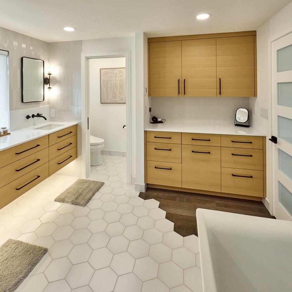 modern master suite remodel with white hex flooring to wood transition and white oak custom cabinetry black mirror frames and door to water room