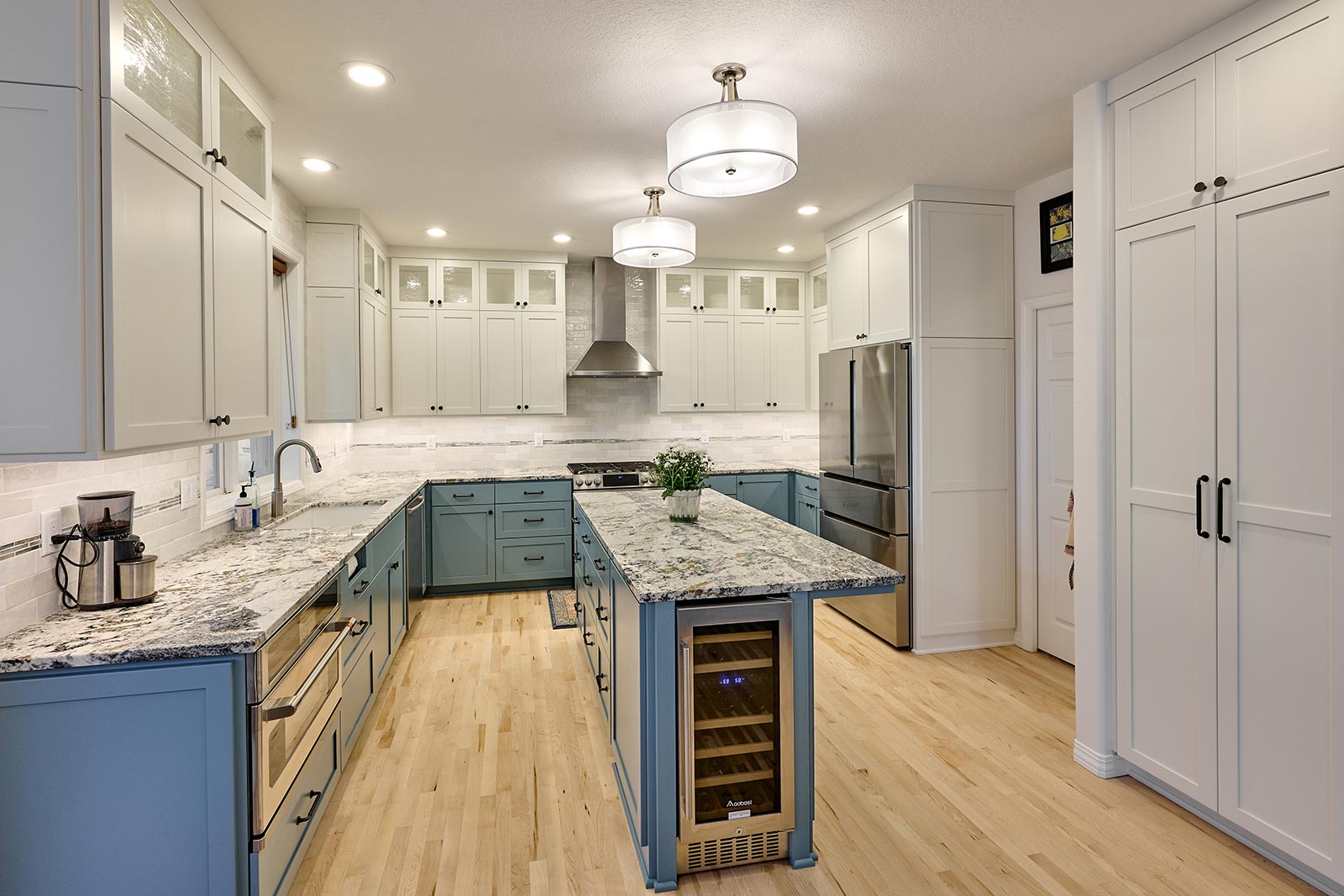 Contemporary kitchen remodel. New custom cabinets in blue. Henderer Design + Build + Remodel