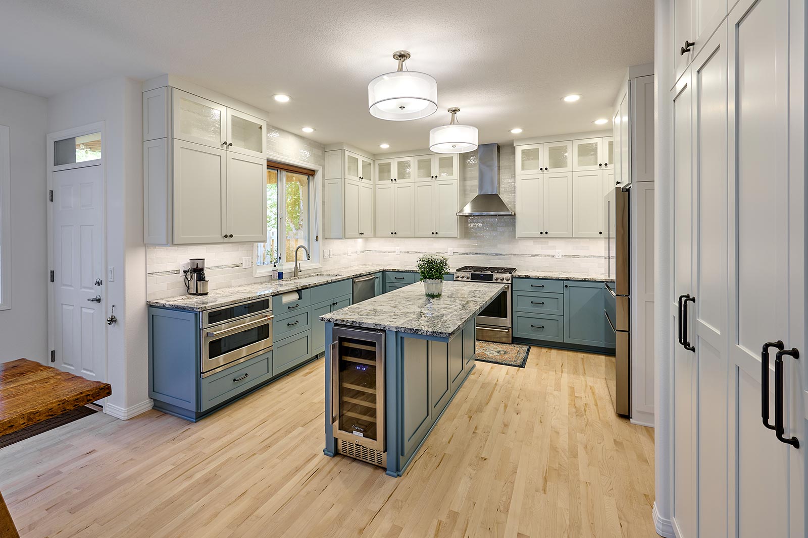 Contemporary kitchen remodel. New custom cabinets in blue. Henderer Design + Build + Remodel